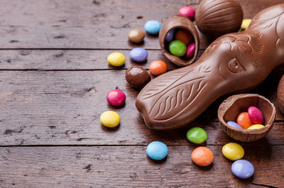 Multi colored candies on wooden table