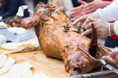 Close-up of hand holding meat