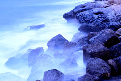 Scenic view of rocks against sky