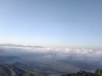 Aerial view of landscape against cloudy sky