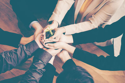 High angle view of people holding hands