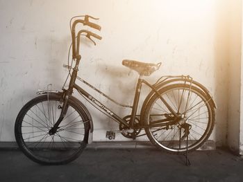 Bicycle parked on wall