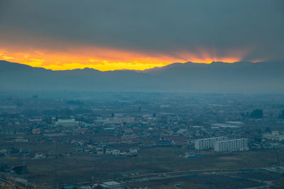 High angle view of cityscape against sky during sunset