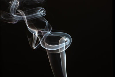 Close-up of smoke against black background