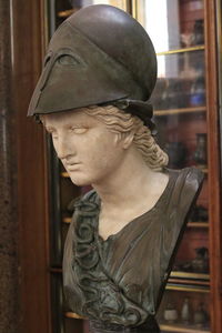 Close-up of statue against window