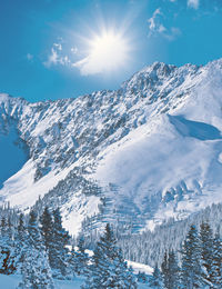 Scenic view of snowcapped mountains against sky