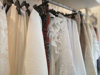 Clothes hanging on rack in store