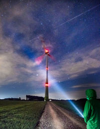 Scenic view of field against sky at night