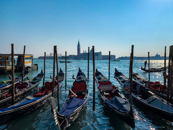 Panoramic view of boats moored in canal