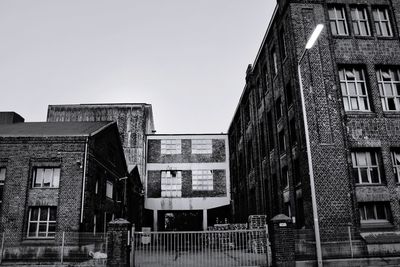 Low angle view of buildings against clear sky