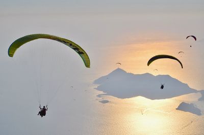 Person paragliding against sky