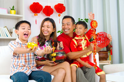 Happy family celebrating chinese new year at home