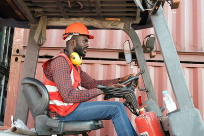 Portrait of young man working at construction site