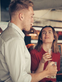 Young man in a drinking glass