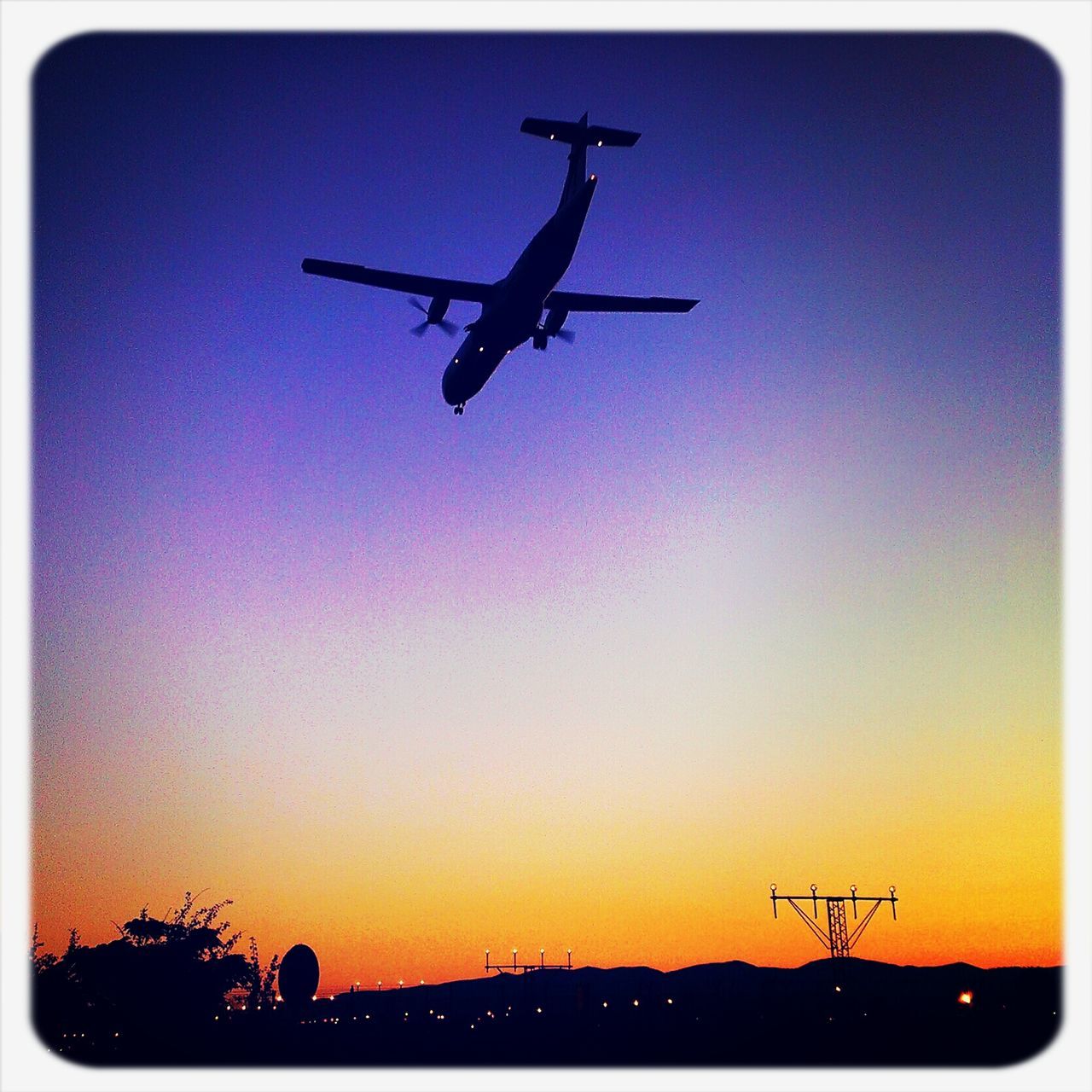 flying, airplane, air vehicle, transportation, mode of transport, mid-air, silhouette, on the move, low angle view, helicopter, public transportation, sunset, clear sky, travel, journey, commercial airplane, flight, sky, copy space, airways