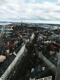 Cityscape against cloudy sky