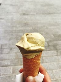 Close-up of hand holding ice cream