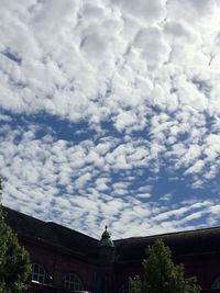 High section of building against cloudy sky