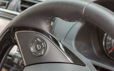 Cropped image of steering wheel