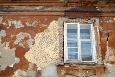 Low angle view of window on old building