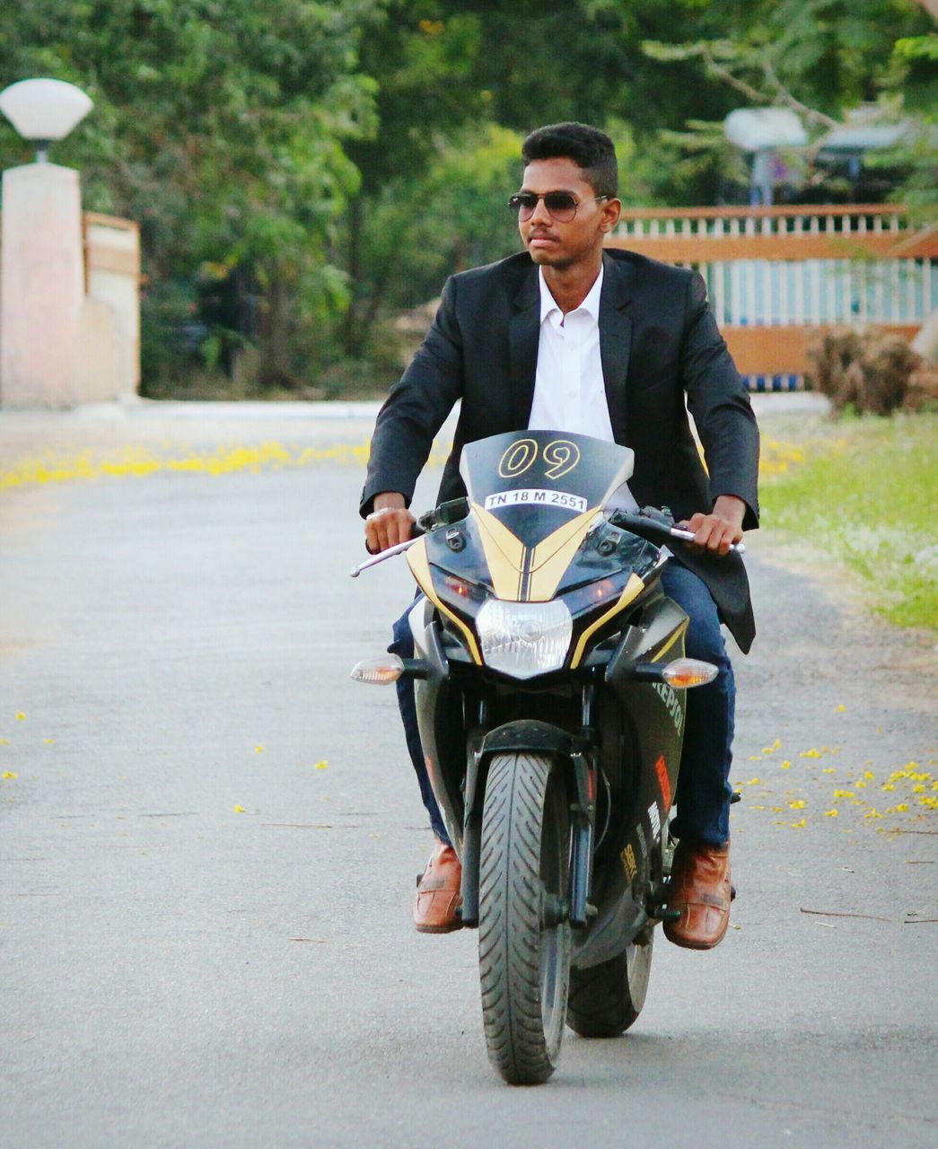 one man only, only men, road, full length, outdoors, front view, travel, fashion, sunglasses, transportation, one person, adults only, suit, day, motorcycle, city, men, well-dressed, adult, young adult, people
