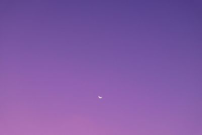 Scenic view of moon against clear sky at night