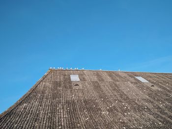 Low angle view of building against blue sky