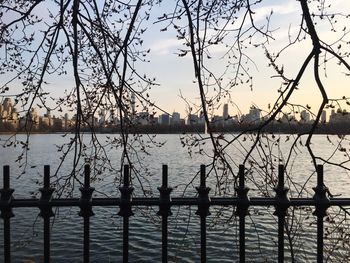 Scenic view of lake against sky at sunset