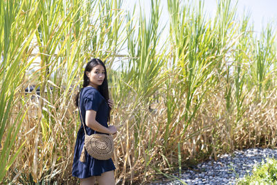 Full length of woman standing on grass