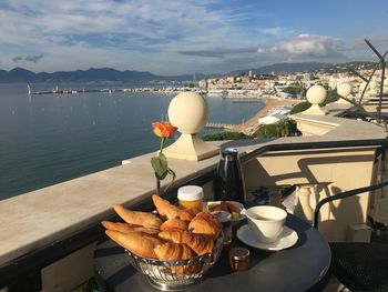 High angle view of breakfast on table against sea