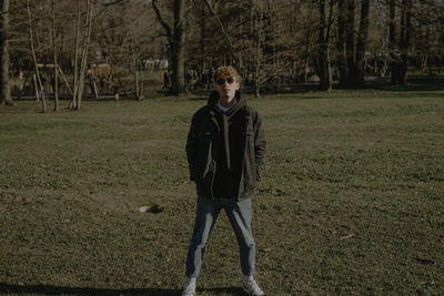 Full length of woman standing on field