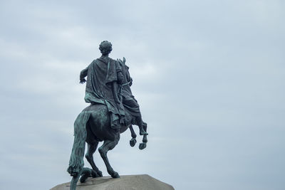 Low angle view of statue against sky