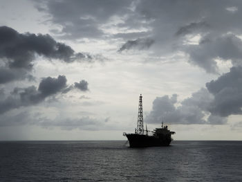 Ship in sea against sky