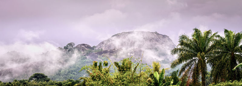 Panoramic view of waterfall against sky