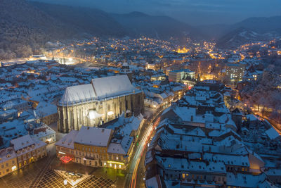 High angle view of illuminated brasov city at dusk