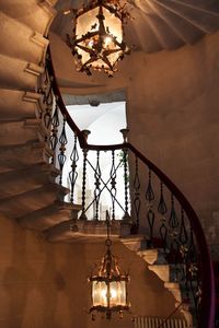 Low angle view of illuminated chandelier in building