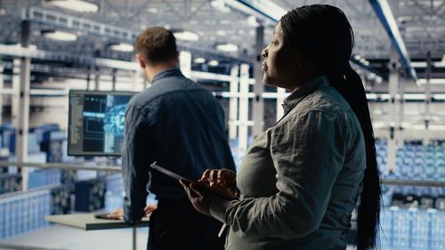 Side view of man using mobile phone