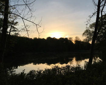 Scenic view of lake at sunset