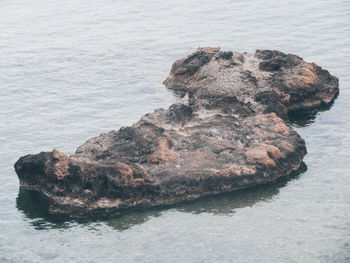 High angle view of rock formation in sea