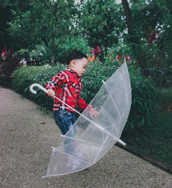 Side view of boy looking at camera