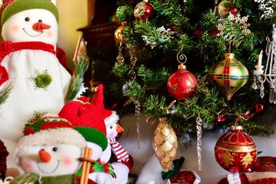 Close-up of christmas decorations hanging on tree