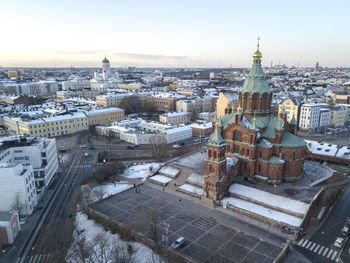 The helsinki cathedral in the background and the orthodox uspenski cathedral in helsinki, finland