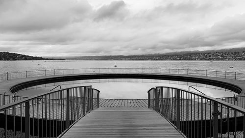 Bridge over sea against sky