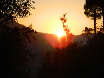 Scenic view of silhouette landscape against sky during sunset