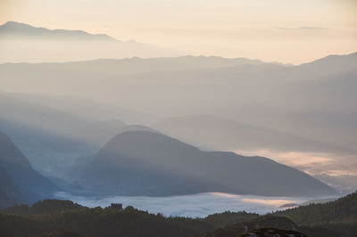 Scenic view of mountains against sky during sunset