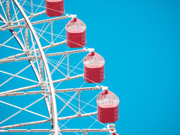 Low angle view of communications tower against clear blue sky