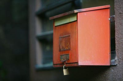 Close-up of red mailbox in box