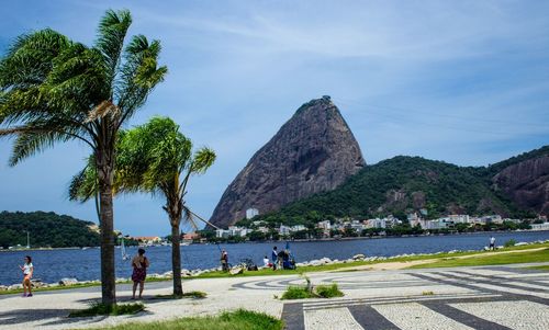 Sugarloaf mountain in sea against sky