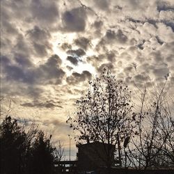 Low angle view of building against cloudy sky