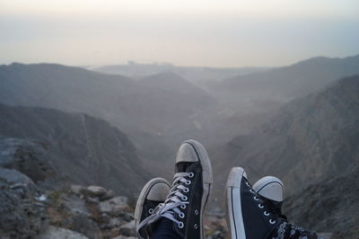 Low section of people relaxing on mountain